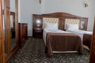 Отель Hotel Giuliano Бухарест Стандартный двухместный номер с 2 отдельными кроватями-1